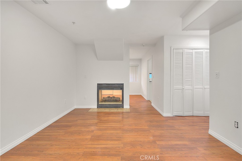 3105 Walton Avenue Los Angeles, CA 90007 - Photo 6 of 38 a view of an empty room and wooden floor