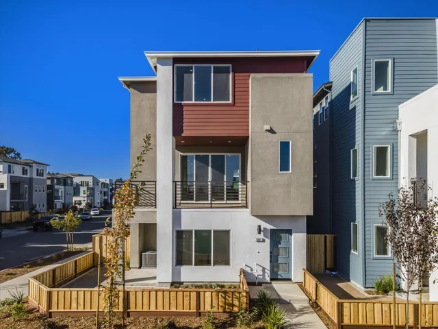 a front view of a house with large windows