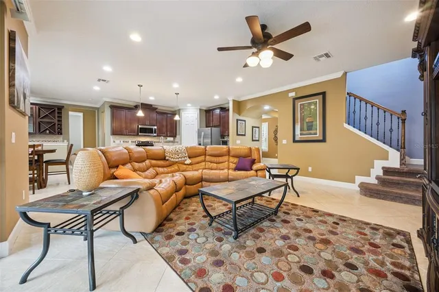 a large kitchen with kitchen island granite countertop a stove a sink a dining table and chairs