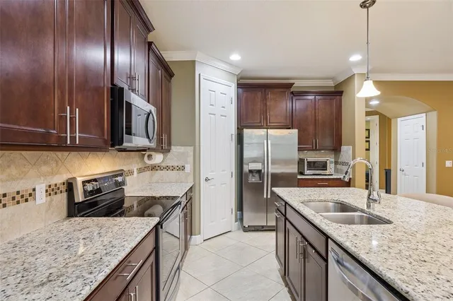 a view of a dining room with furniture and window
