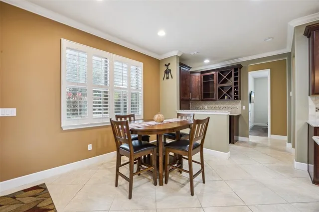 a kitchen with cabinets and wooden floor