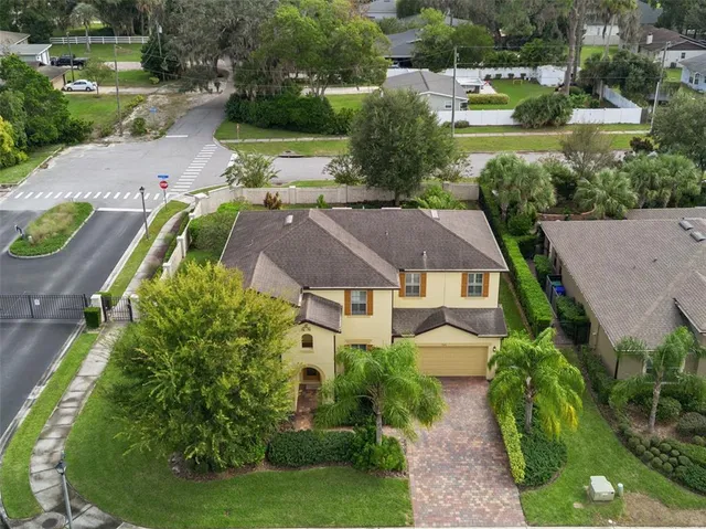 an aerial view of a house with a garden
