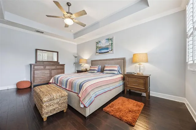 a spacious bathroom with a granite countertop sink and a mirror