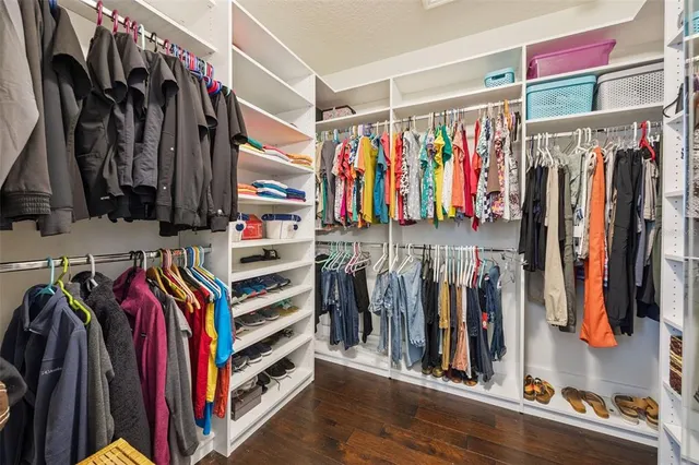a bedroom with a bed dresser and a window