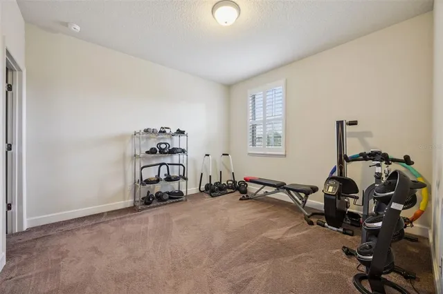 a view of a patio with table and chairs