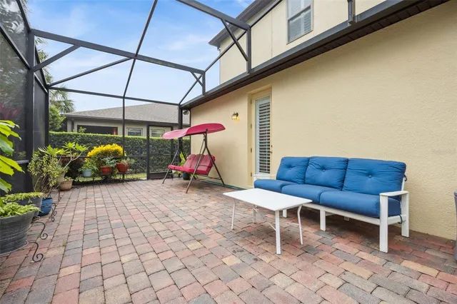 a view of a chairs and table in the patio