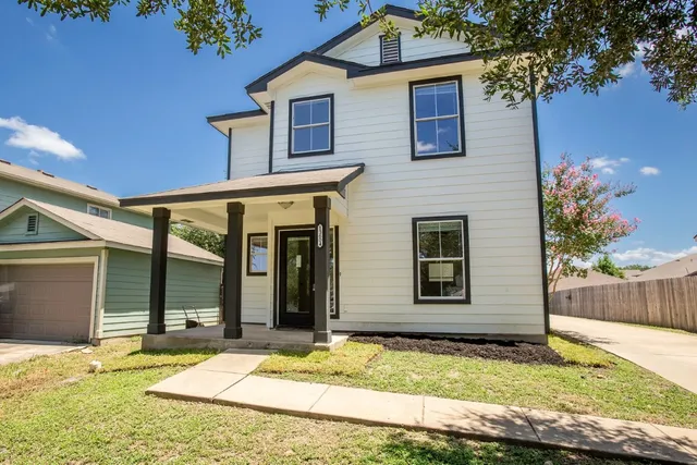 a view of a house with small yard