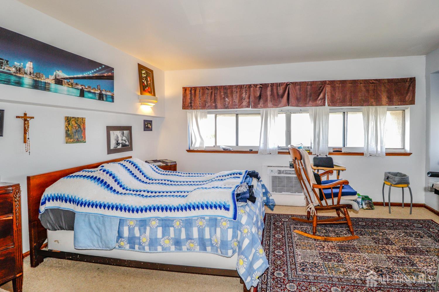 40 Fayette Street, Unit 57 Perth Amboy, NJ 08861 - Photo 24 of 33 a bedroom with furniture and windows