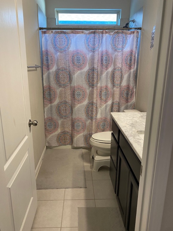 2034 Brisbane Way Bryan, TX 77807 - Photo 11 of 26 a bathroom with a granite countertop sink a toilet a mirror and shower
