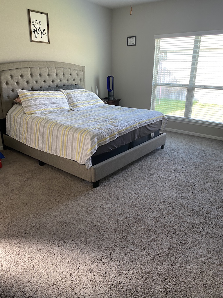 2034 Brisbane Way Bryan, TX 77807 - Photo 14 of 26 a bed sitting in a bedroom next to a window