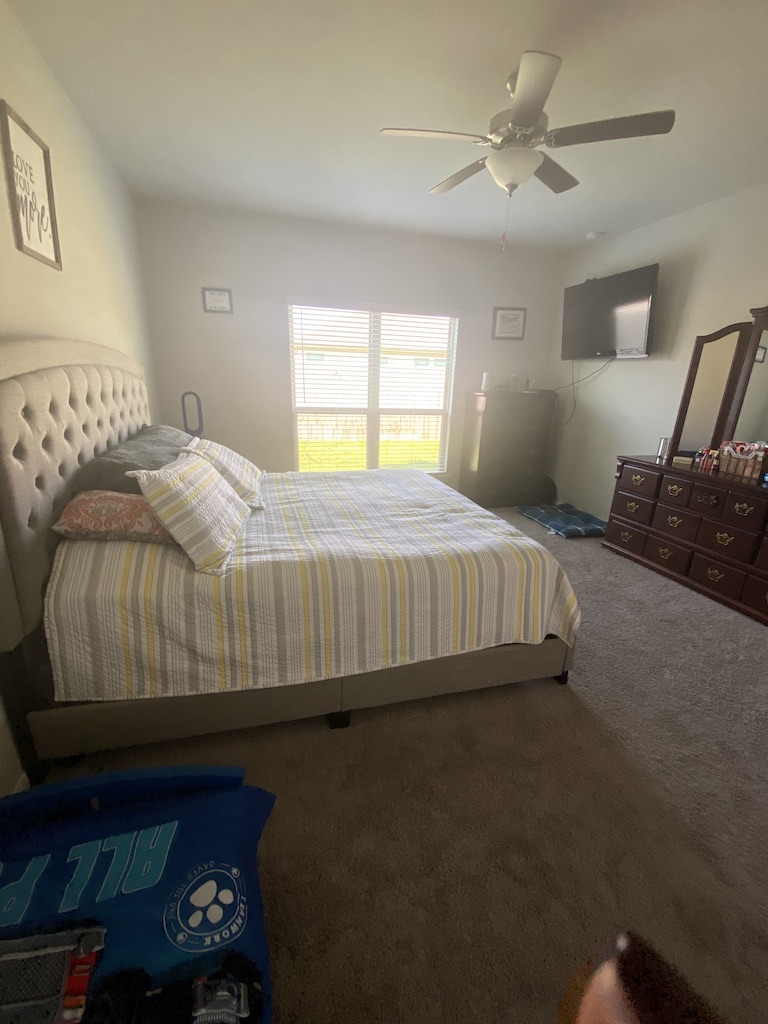 2034 Brisbane Way Bryan, TX 77807 - Photo 16 of 26 a bedroom with a bed and a window