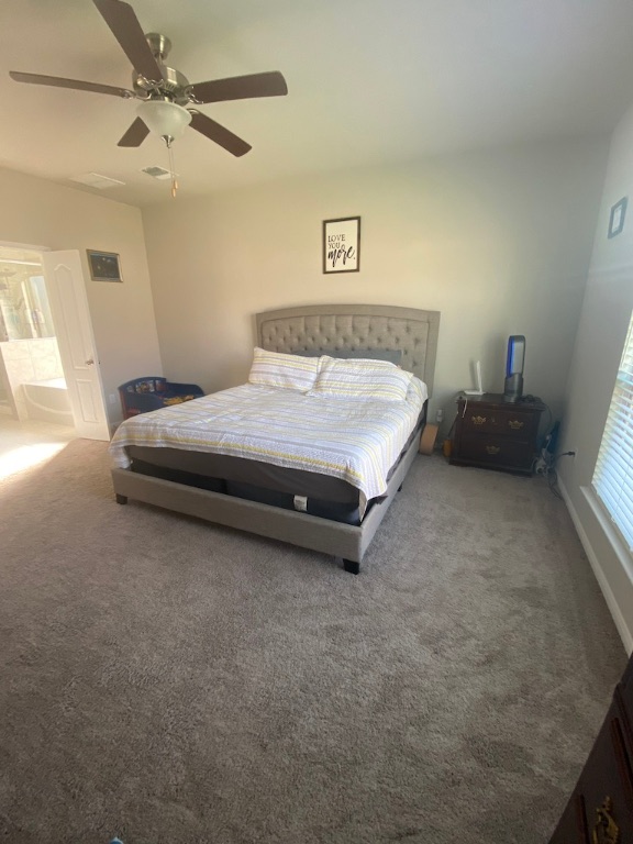2034 Brisbane Way Bryan, TX 77807 - Photo 17 of 26 a spacious bedroom with a bed and furniture