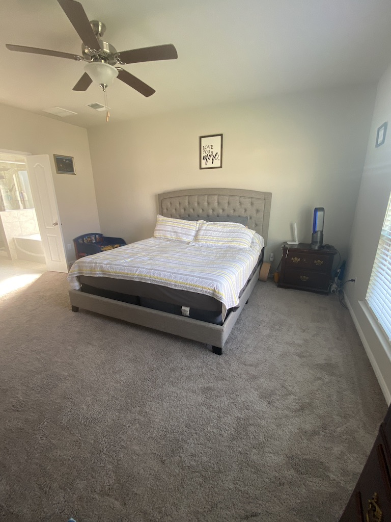 2034 Brisbane Way Bryan, TX 77807 - Photo 17 of 26 a spacious bedroom with a bed and furniture