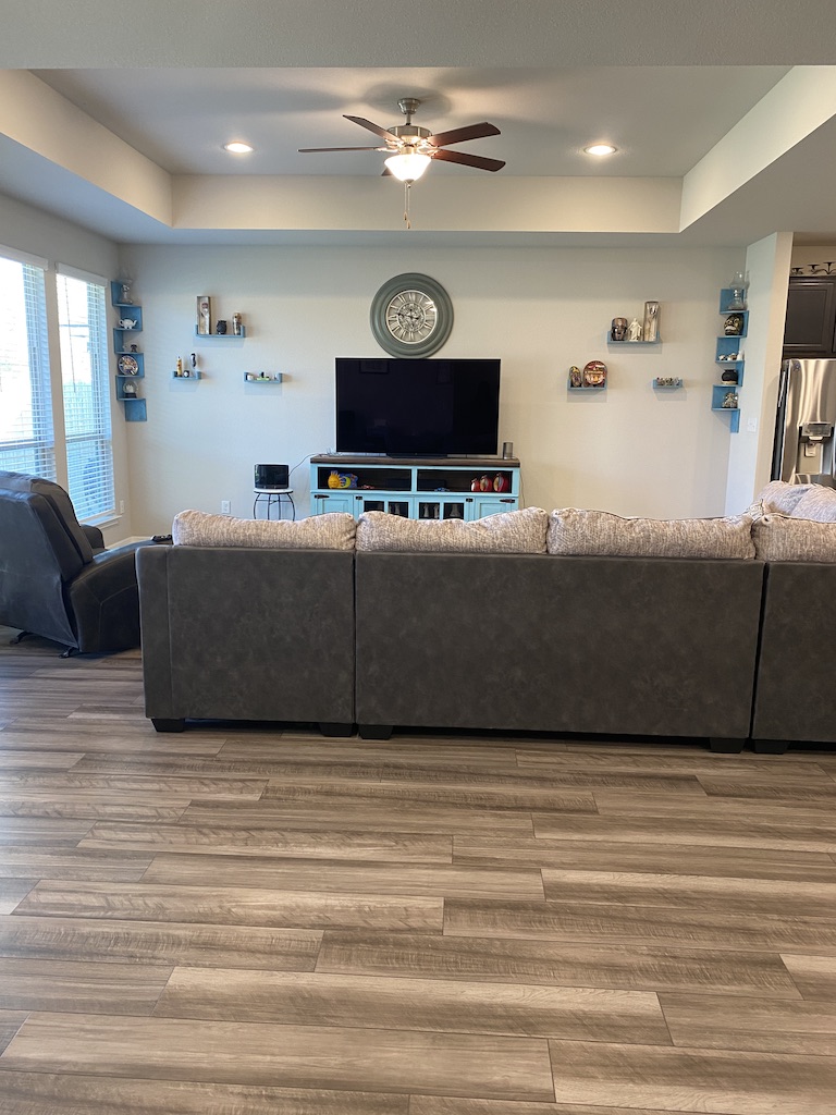 2034 Brisbane Way Bryan, TX 77807 - Photo 4 of 26 a living room with furniture and a wooden floor