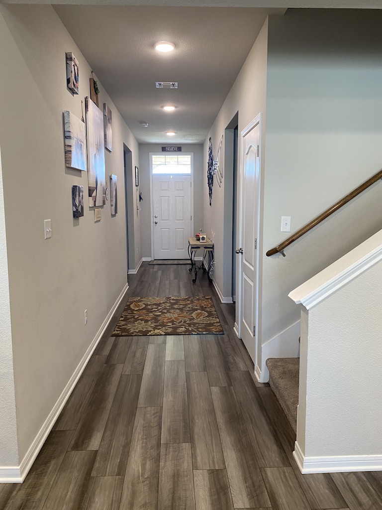 2034 Brisbane Way Bryan, TX 77807 - Photo 9 of 26 a view of a hallway with wooden floor