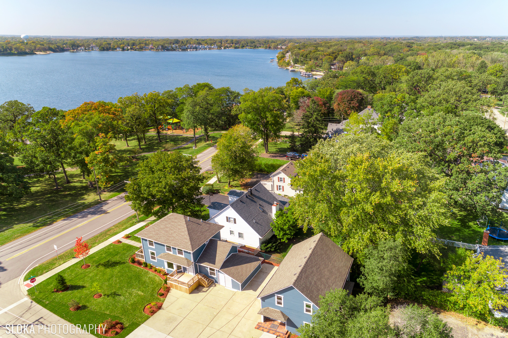an aerial view of a house with a lake view