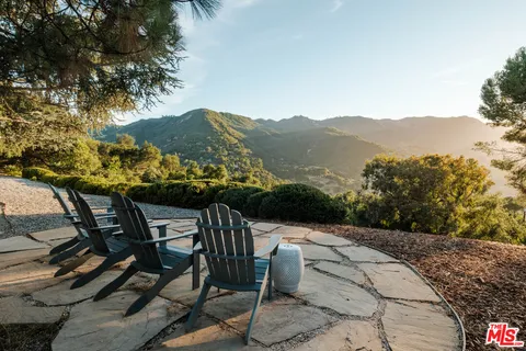 a view of a chairs and table on the terrace