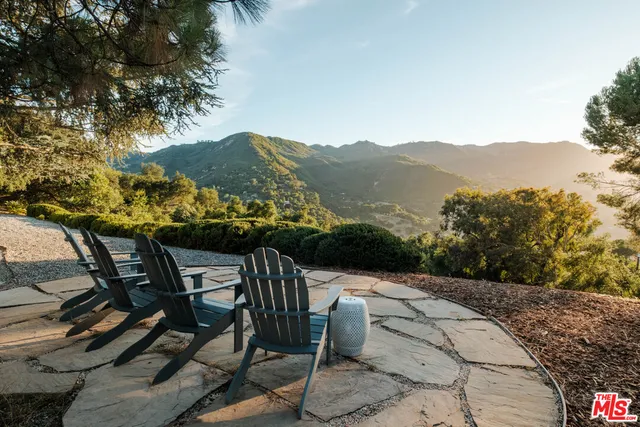 a view of a chairs and table on the terrace