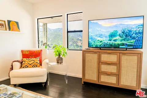 a bedroom with furniture and a window