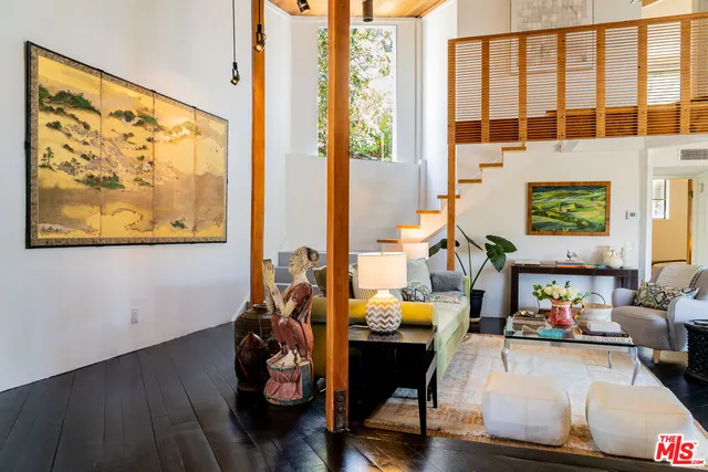 a room with furniture and wooden floor