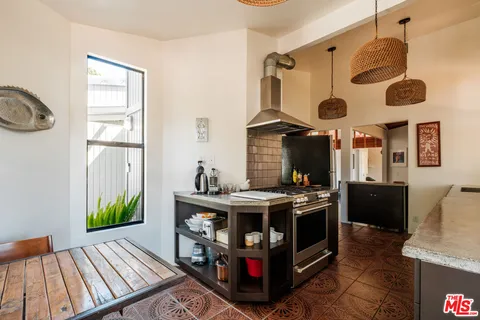 a view of kitchen and dining room with wooden floor