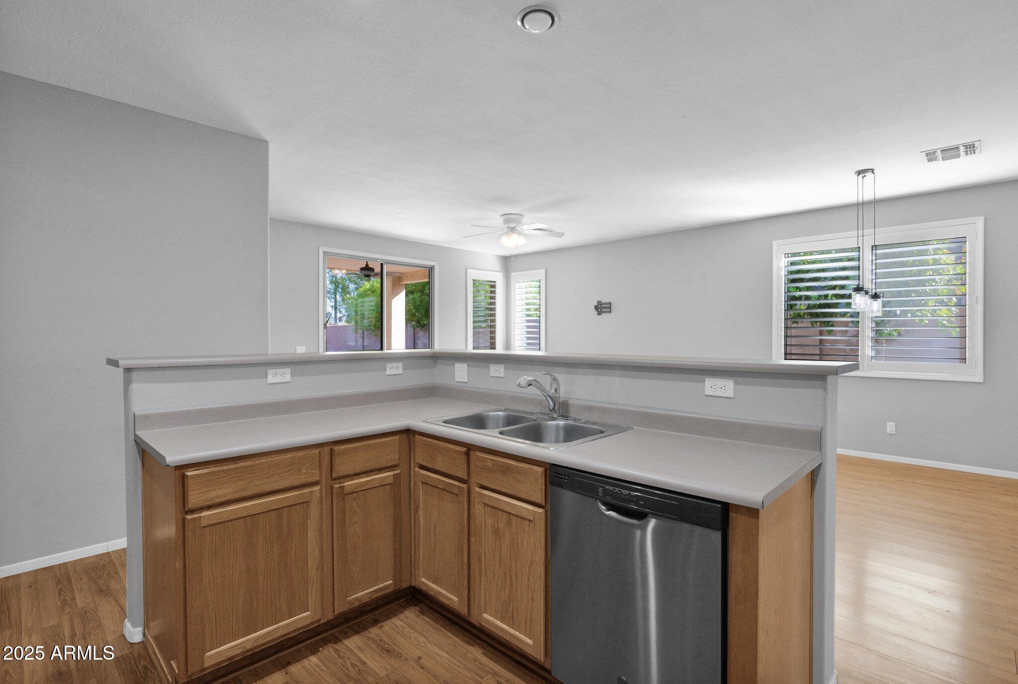 2190 East Augusta Avenue Chandler, AZ 85249 - Photo 13 of 35 a kitchen with a sink stove and cabinets