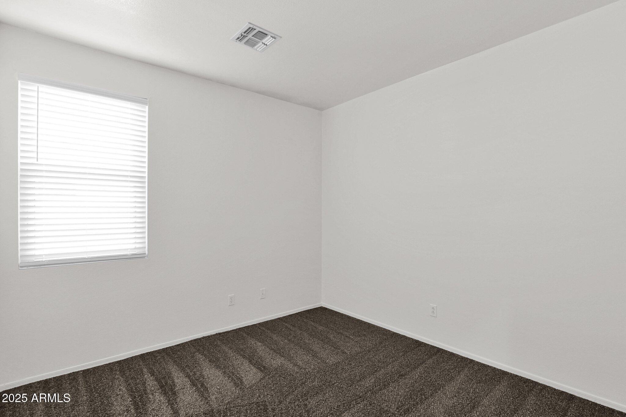2190 East Augusta Avenue Chandler, AZ 85249 - Photo 18 of 35 an empty room with a window