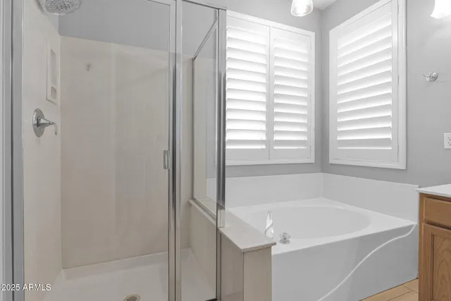 a white bath tub sitting next to a window