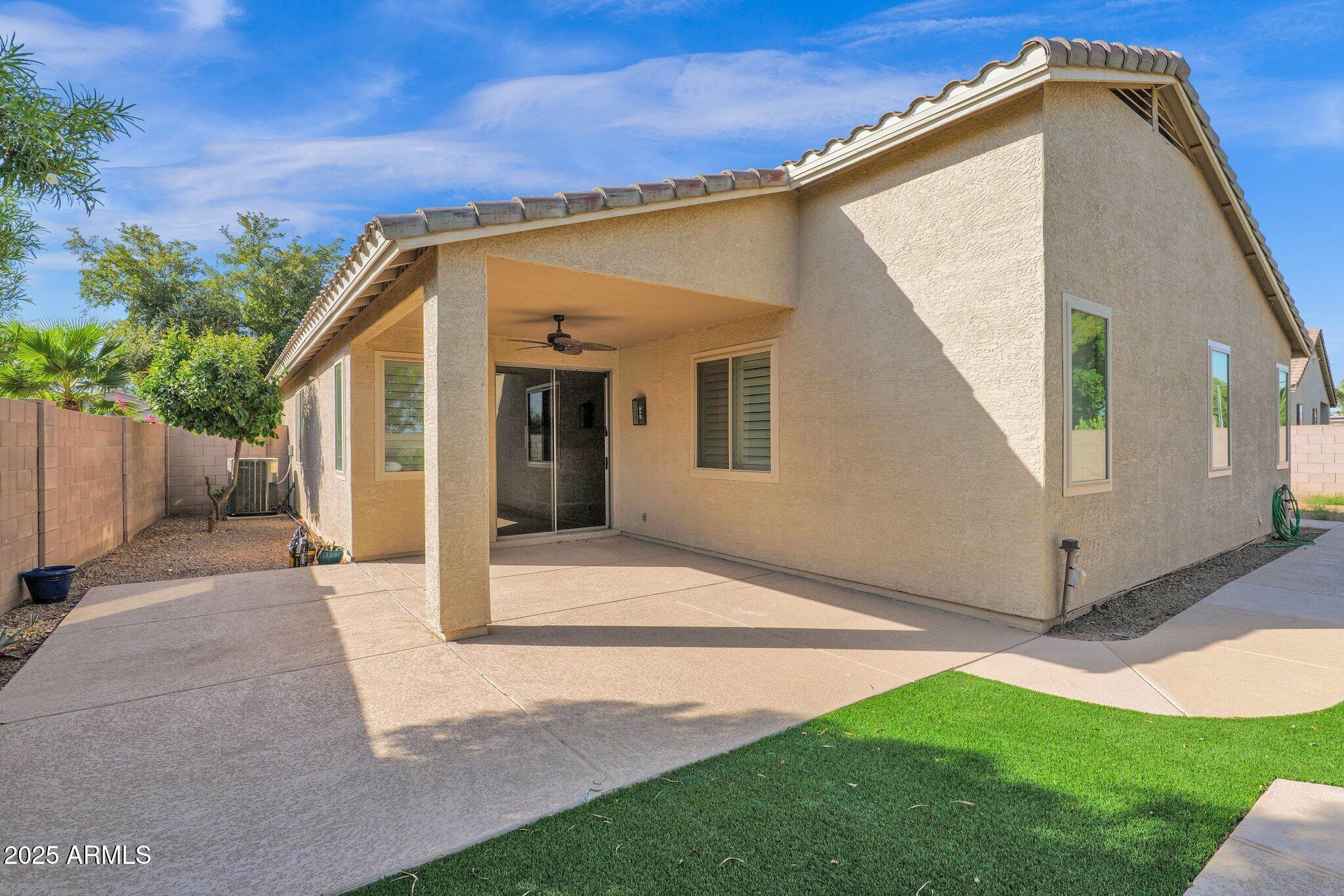 2190 East Augusta Avenue Chandler, AZ 85249 - Photo 26 of 35 a view of a house with backyard and a tree