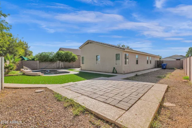 a view of a backyard of the house