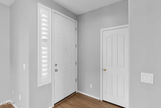 a view of a bathroom with wooden floor