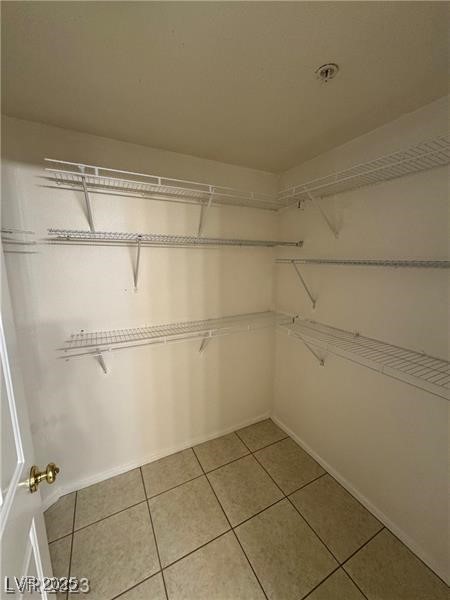 7155 South Durango Drive, Unit 304 Las Vegas, NV 89113 - Photo 11 of 16 walk in closet in primary bedroom