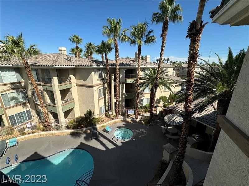 7155 South Durango Drive, Unit 304 Las Vegas, NV 89113 - Photo 16 of 16 View of pool from patio