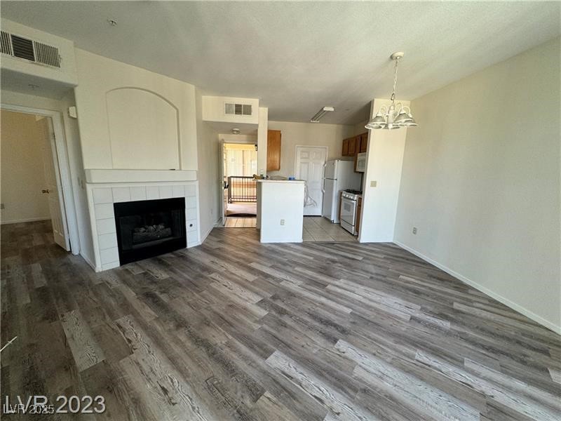 7155 South Durango Drive, Unit 304 Las Vegas, NV 89113 - Photo 4 of 16 Living room with gas fireplace