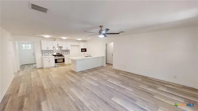 a view of a livingroom with a hardwood