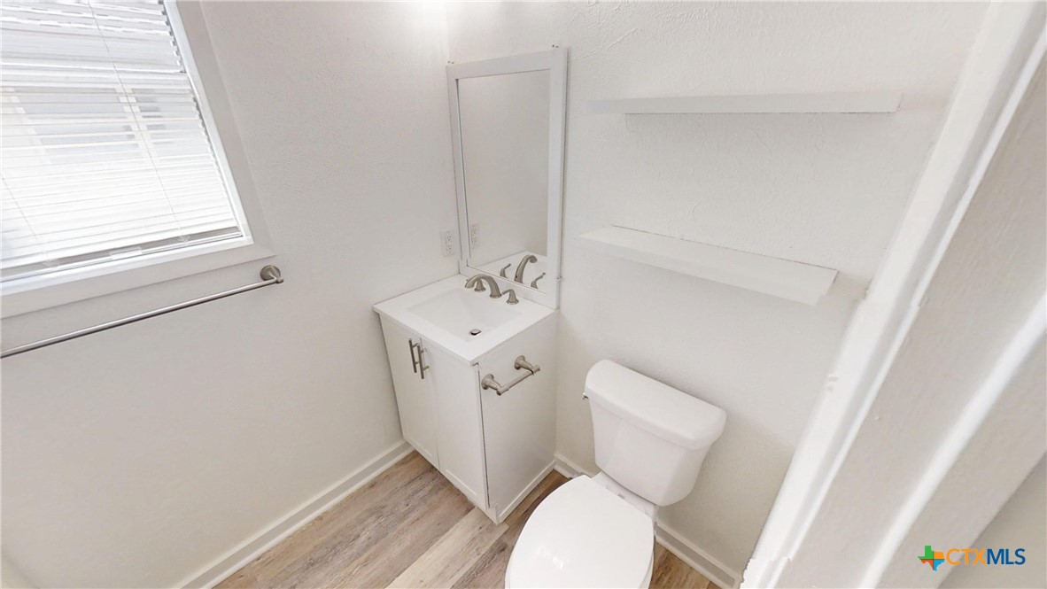 4118 Ermine Trail Temple, TX 76504 - Photo 16 of 31 a white toilet sitting next to a small sink