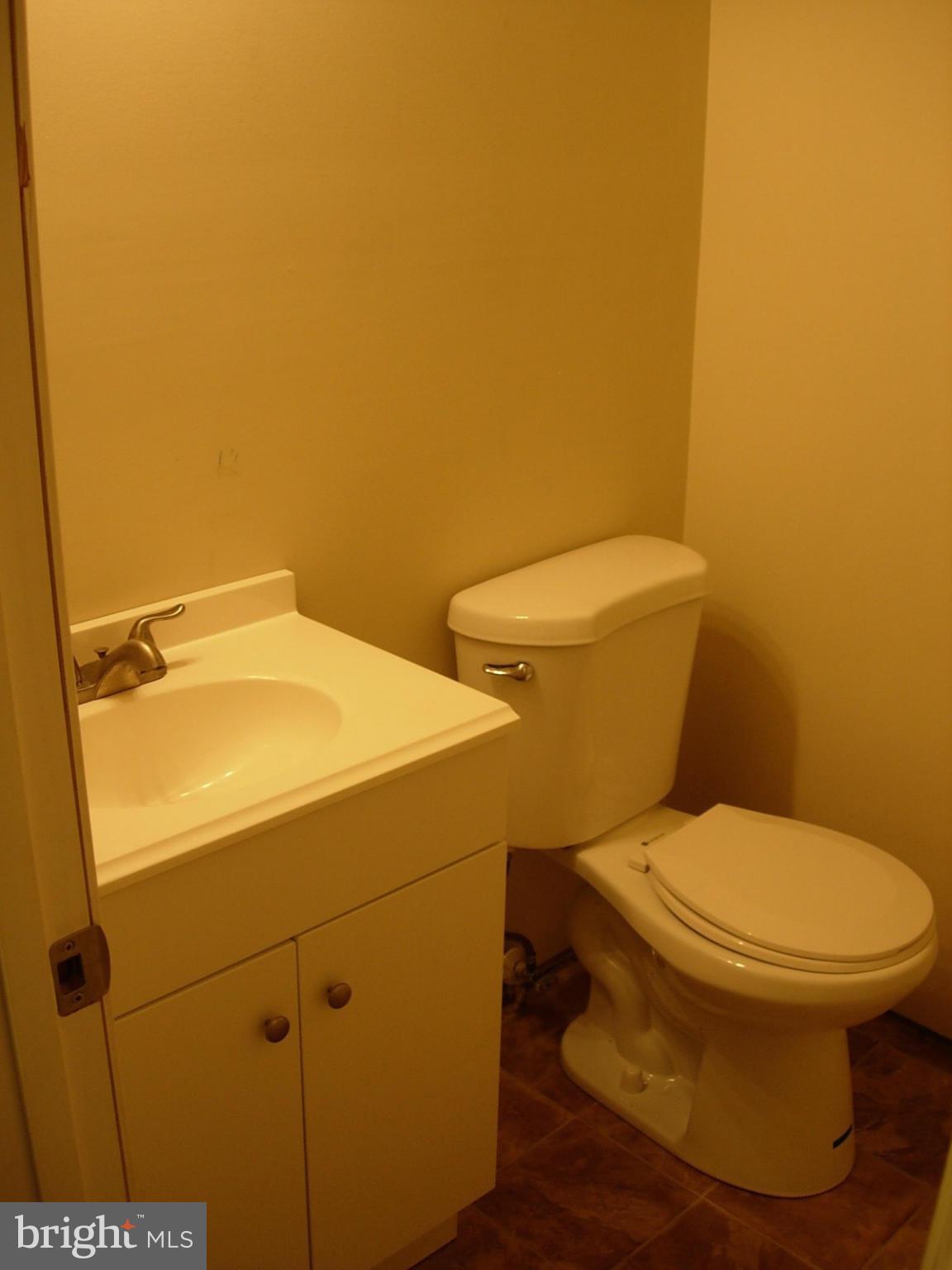 205 Ritter Place Berryville, VA 22611 - Photo 14 of 29 a white toilet sitting next to a shower