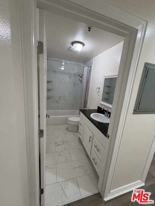 121 South Rampart Boulevard, Unit 3 Los Angeles, CA 90057 - Photo 11 of 20 a bathroom with a sink a mirror and a shower