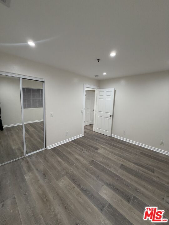 121 South Rampart Boulevard, Unit 3 Los Angeles, CA 90057 - Photo 15 of 20 an empty room with wooden floor and cabinet