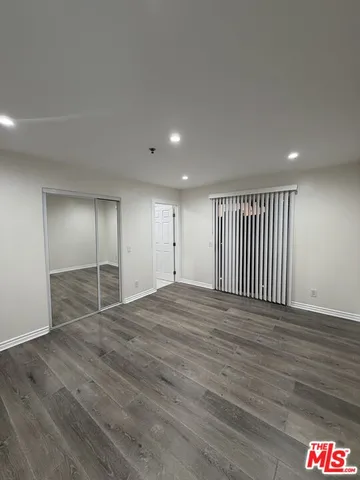 an empty room with wooden floor