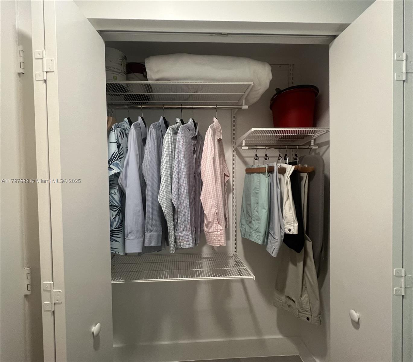 90 Southwest 3rd Street, Unit 1514 Miami, FL 33130 - Photo 13 of 25 a view of walk in closet with clothes and shoes