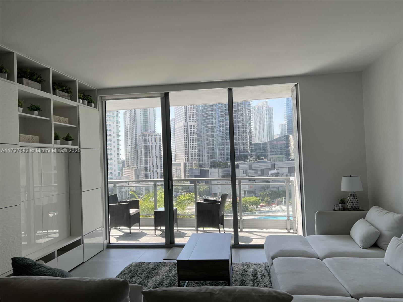 90 Southwest 3rd Street, Unit 1514 Miami, FL 33130 - Photo 15 of 25 a living room with furniture and a large window