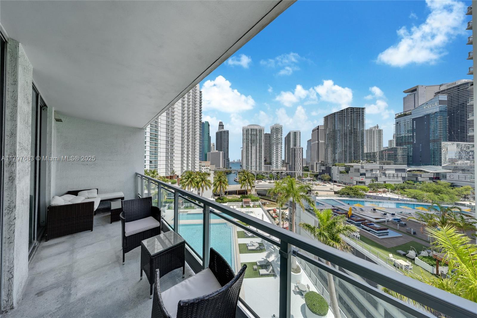 90 Southwest 3rd Street, Unit 1514 Miami, FL 33130 - Photo 2 of 25 a view of swimming pool with outdoor seating