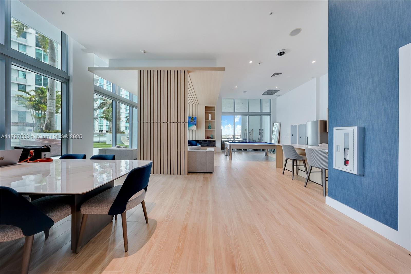 90 Southwest 3rd Street, Unit 1514 Miami, FL 33130 - Photo 25 of 25 a dining room with furniture and wooden floor
