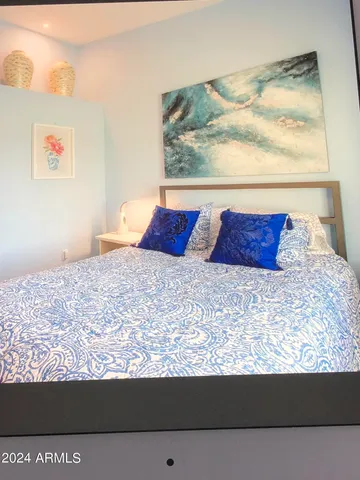 a living room with granite countertop furniture and a potted plant