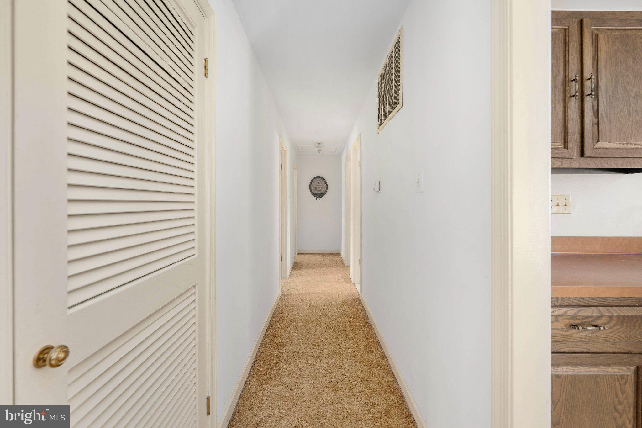 279 Harbor Drive Reedville, VA 22539 - Photo 28 of 97 Inviting hallway with warm tones.