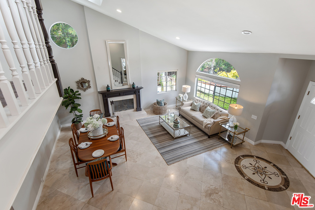 26021 Farmfield Road Calabasas, CA 91302 - Photo 20 of 50 a living room with furniture and a wooden floor