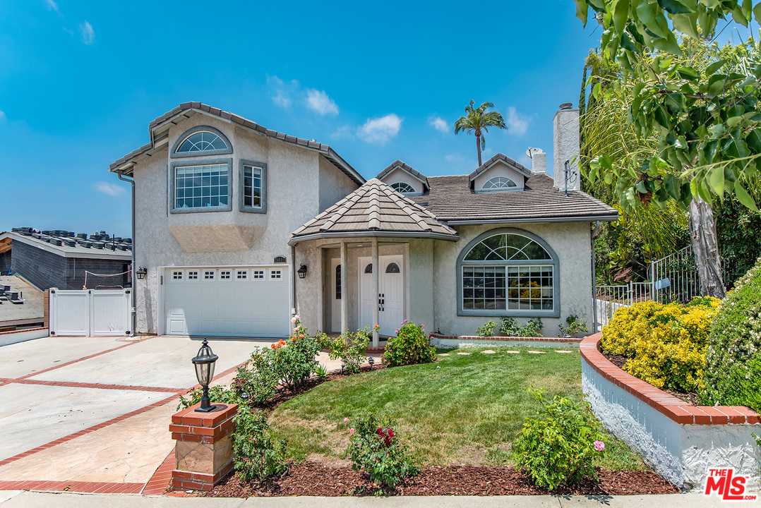 26021 Farmfield Road Calabasas, CA 91302 - Photo 3 of 50 a front view of a house with garden
