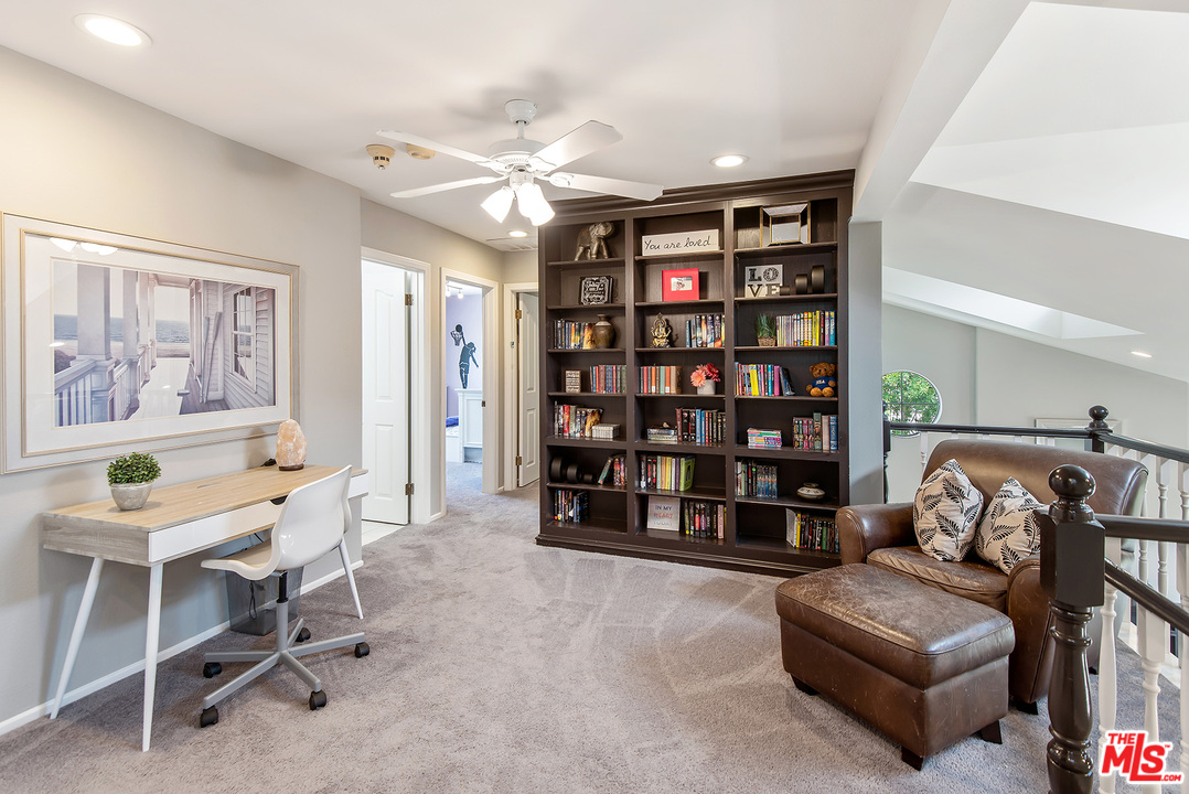 26021 Farmfield Road Calabasas, CA 91302 - Photo 21 of 50 a living room with furniture and decor
