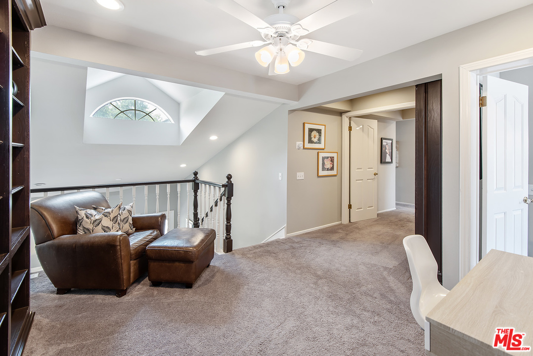 26021 Farmfield Road Calabasas, CA 91302 - Photo 22 of 50 a living room with furniture and a ceiling fan